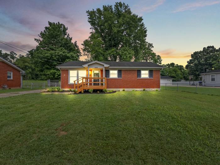 A home listed by Carmen Cabral in Louisville at dusk